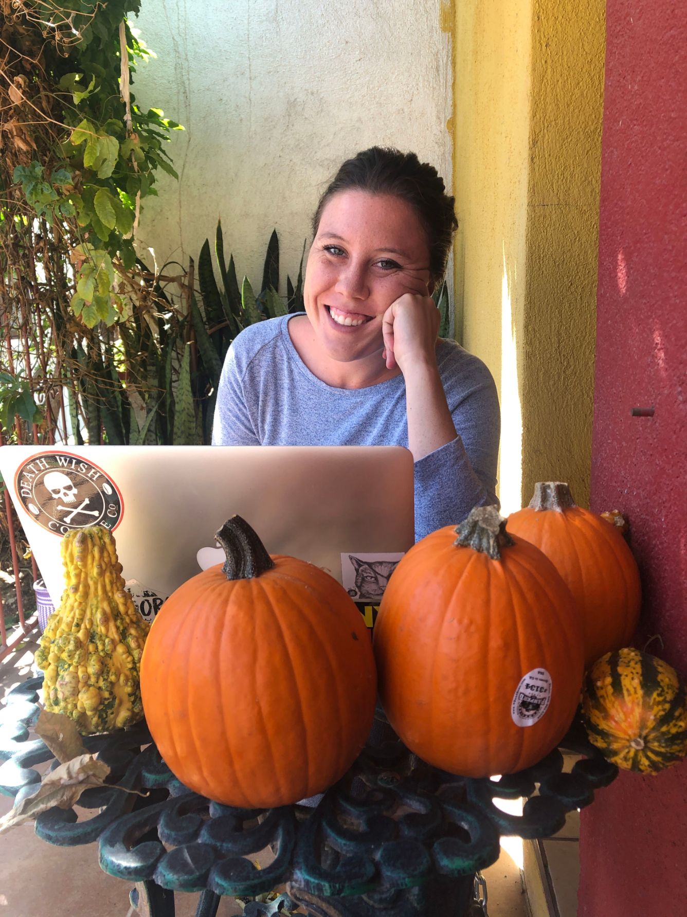 smiling on the front porch of our Airbnb in Oaxaca, Mexico
