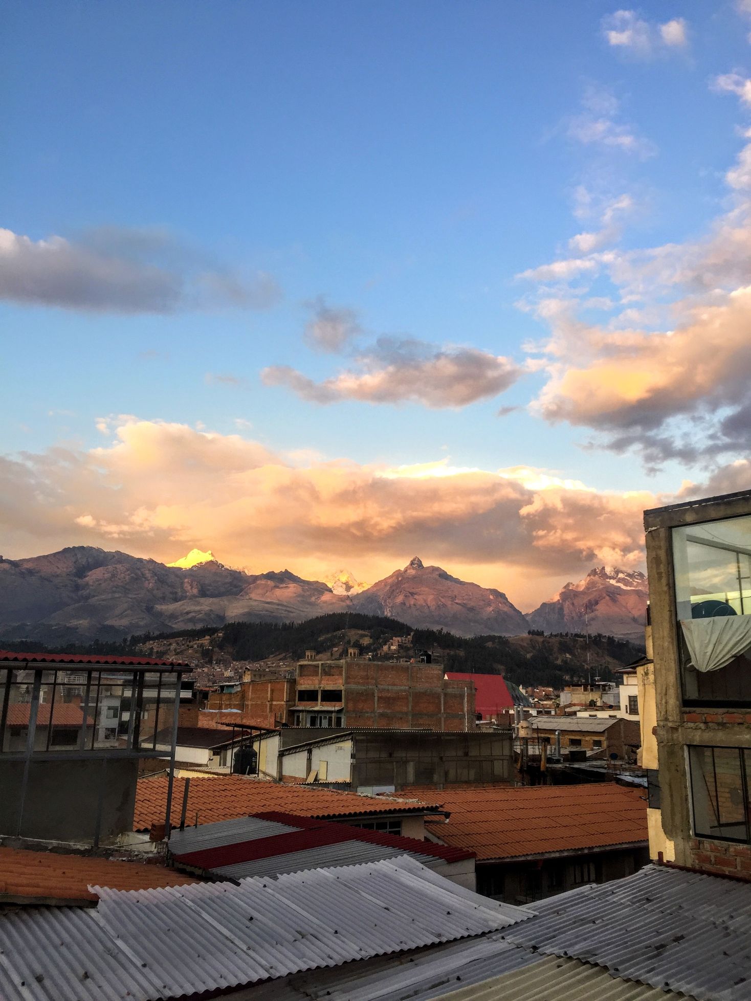 view of mountains at sunset over the town of Huaraz, Peru